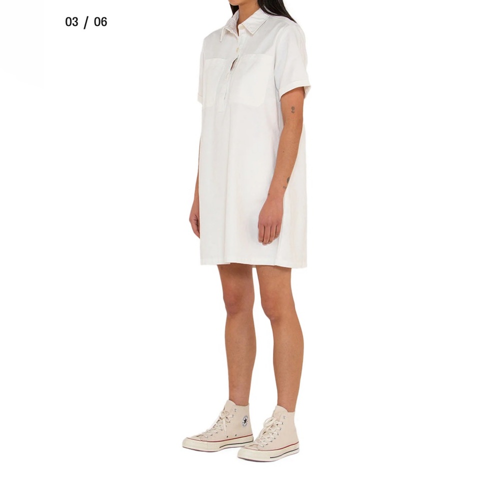White short sleeve shirt dress with pockets. Relaxed fit.